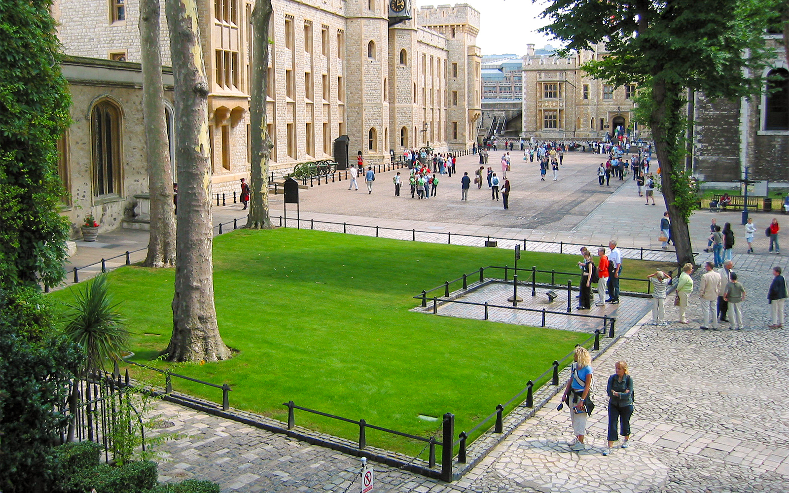 Tower of London execution block with Beefeater guiding early access tour group